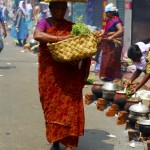 Woman selling items to needy devotees in Attukal Pongala