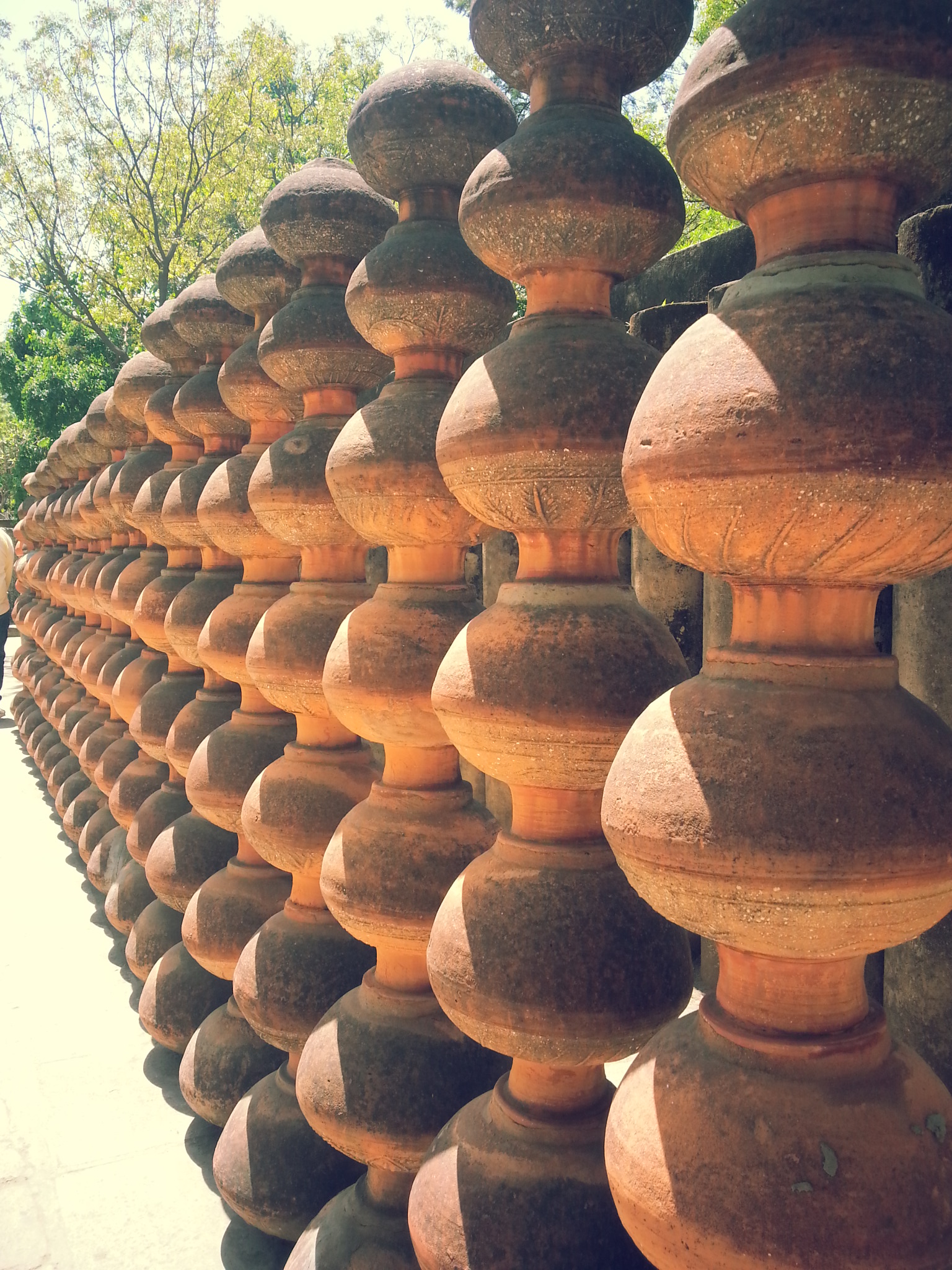 Structure made from pots in the rock garden