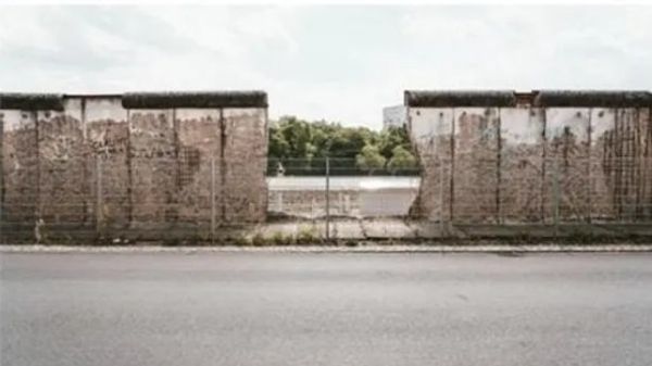 The destruction of this famous barrier began in which year?