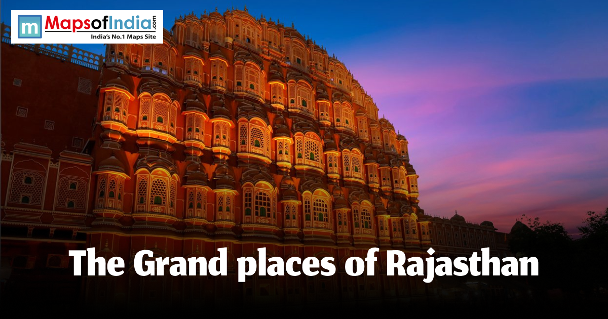 Illuminated view of Hawa Mahal in Jaipur at sunset, showcasing the architectural grandeur of Rajasthan's royal palaces.