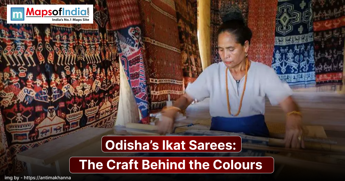 A woman artisan is weaving on a traditional handloom surrounded by vibrant, intricately patterned Odisha Ikat fabrics displayed on the walls, showcasing the rich colours and craftsmanship of the region.