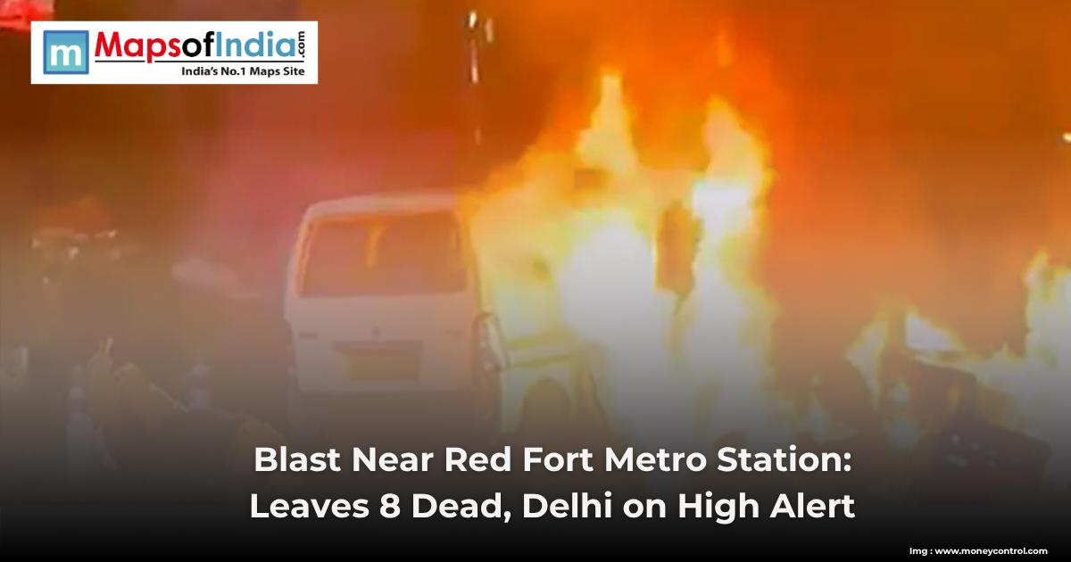 A van engulfed in flames after a blast near Red Fort Metro Station, with emergency alert text overlayed.