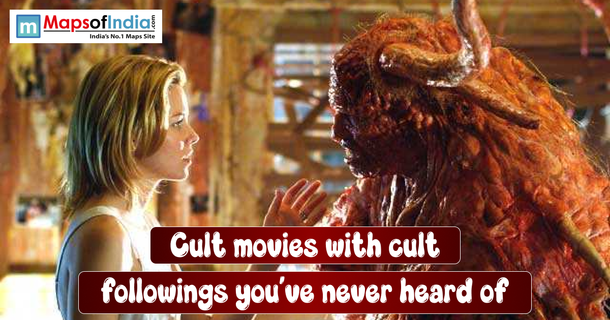 A woman stands face-to-face with a large, monstrous creature inside a dim, cluttered room. She reaches her hand toward the creature as they appear to confront or communicate with each other.
