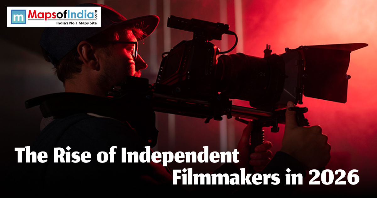 A filmmaker in a baseball cap operating a professional cinema camera in a dark room with dramatic red lighting, featuring the text "The Rise of Independent Filmmakers in 2026."