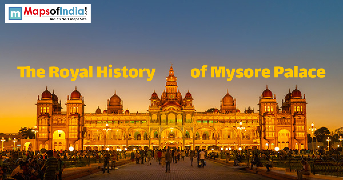 Illuminated Mysore Palace at dusk with visitors, showcasing its royal architecture and grandeur
