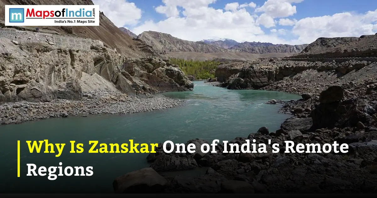 A turquoise river flowing through a rugged, rocky mountain valley, featuring the MapsOfIndia logo at the top left and text reading "Why Is Zanskar One of India's Remote Regions" at the bottom.