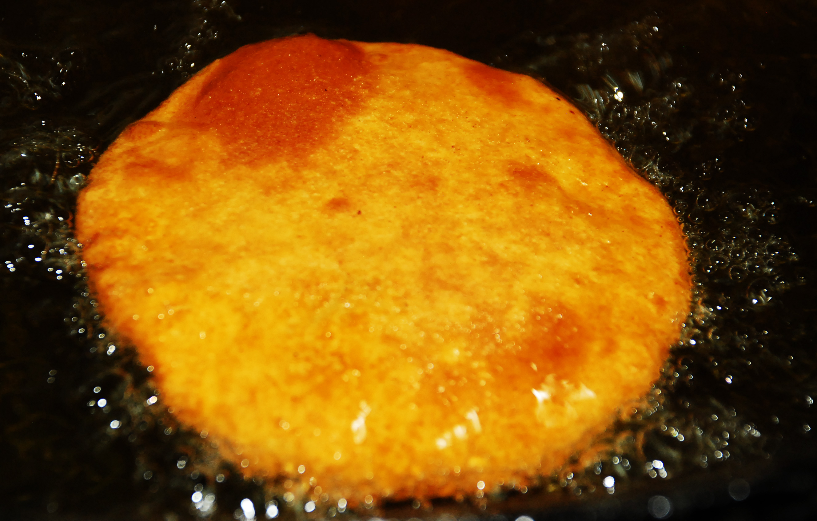 Deep Frying Poori in Hot Oil
